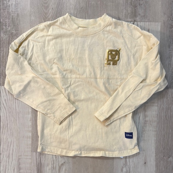 Disney Other - Disney Kids Cream Spirit Jersey with Gold Logo